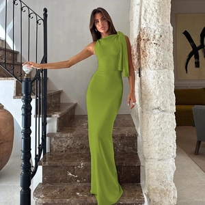 Detailed view of lime green one-shoulder maxi dress with elegant pleats and long drape