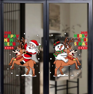 Detail of 2025 Christmas window clings featuring Santa, snowman, and reindeer on glass door