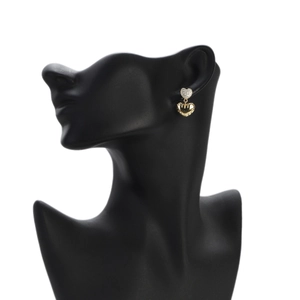 Elegant gold double heart earrings with zircon micro-paving on a black jewelry bust