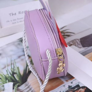 Cute lavender faux leather kids crossbody bag with golden flower charm and white rope strap