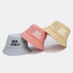 Three cotton canvas bucket hats with NEW WORLD embroidery in gray, pink and beige