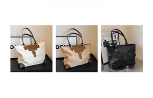 Detailed view of oxford tote bag options in white, brown, and black with leather accents