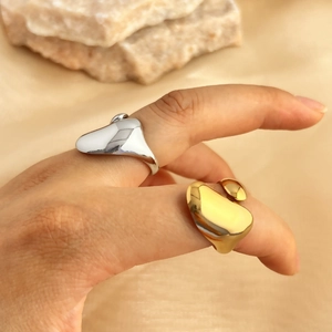Minimalist 18K gold and silver water drop rings with liquid lava texture for women