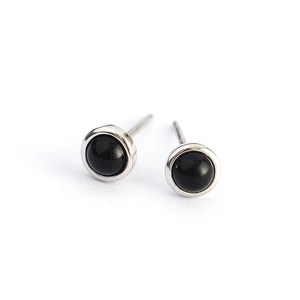 Minimalist S925 silver stud earrings with round black agate stones on a clean white background