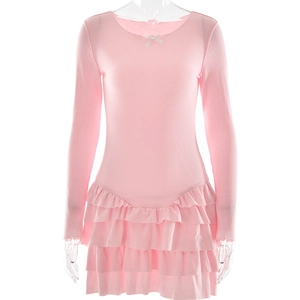 Detail of pink ribbed dress with layered ruffles and delicate bow on the crew neck