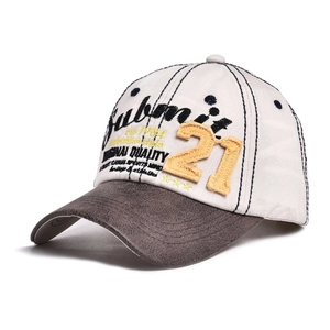 Close-up of vintage baseball cap with Submit embroidery and 21 patch detail
