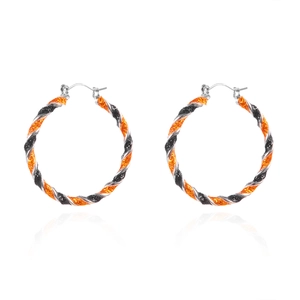 Halloween orange and black twisted hoop earrings with glitter finish on white background