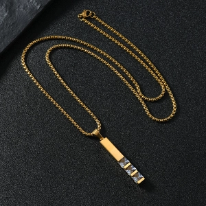 Gold stainless steel necklace with geometric bar pendant and three zircon stones