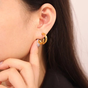 Minimalist 18k gold plated C-shaped double hoop earrings shown on a female model