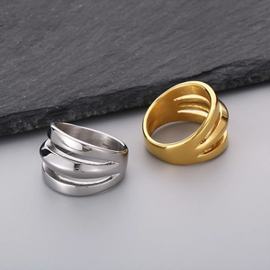 Three-layer wavy stainless steel rings in silver and gold with high-polish mirror finish