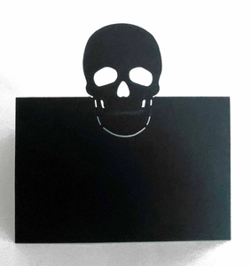 Halloween black matte skull place card with intricate laser-cut hollow design for table decor