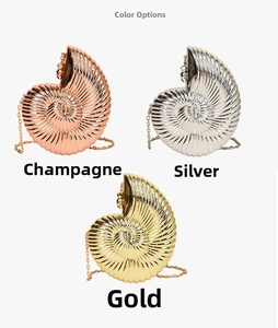 Detailed display of shell-shaped evening clutches in champagne, silver, and gold metal finish