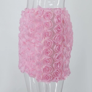 Detailed close-up of pink 3D rose petal textures on a slim mini skirt for women
