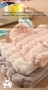 Close-up of soft coral fleece hair towels with bunny ears and elastic ribbed texture