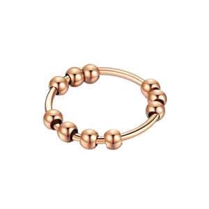 Close-up of rose gold stainless steel anti-anxiety ring with 10 rotating beads