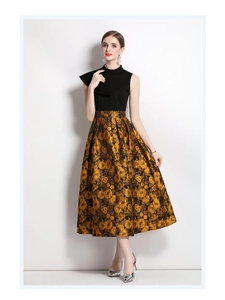 Detail of elegant black and gold jacquard dress with textured vintage patterns