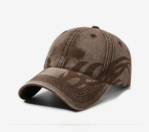 Detail view of vintage washed brown baseball cap with LA&DH embroidery and flame pattern
