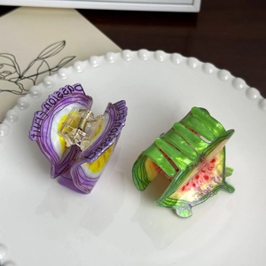 Cute fruit-themed hair claws featuring watermelon and passion fruit patterns in a set