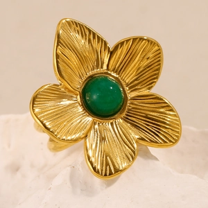 Detailed macro view of 18K gold plated flower ring with green turquoise stone inlay