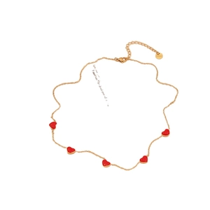 Elegant gold stainless steel necklace with five red enamel heart pendants on a slim chain