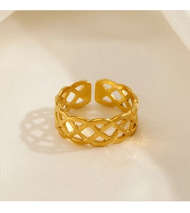 Detailed close-up of 18K gold plated braided hollow ring on ivory silk background