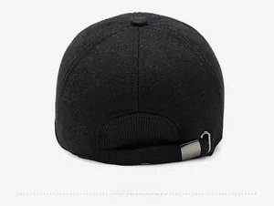 Detail of adjustable gunmetal buckle and ribbed elastic back on winter baseball cap