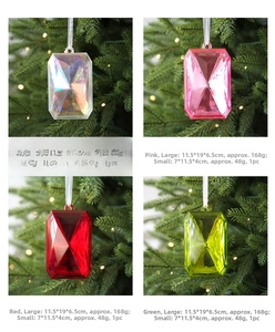 Detailed view of faceted acrylic gem ornaments in four colors for Christmas tree decor