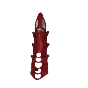 Detailed close-up of a red punk articulated full finger ring with heart-shaped cutouts