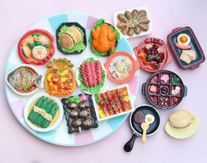 Detailed macro view of miniature resin food magnets featuring Chinese and Western cuisine