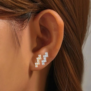 F136 titanium Z-shape earrings with rectangular zircon studs shown on female model