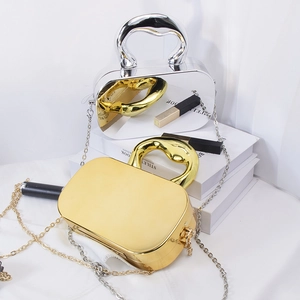 Metallic acrylic mirror box bags with chunky top handles and chain straps in gold and silver