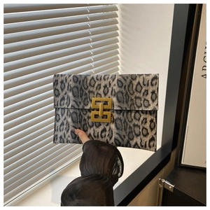 Detail of grey leopard print clutch bag with vintage gold square interlocking buckle