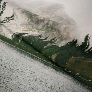 Detailed macro view of heavy fabric texture on landscape tapestry with mountain print