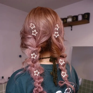 Minimalist silver star hair clips styled on a purple braid for women's hair accessories