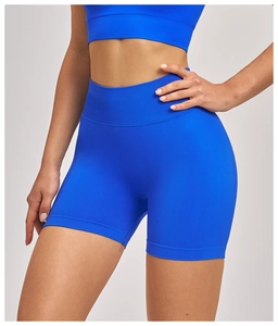 Close-up of royal blue seamless ribbed yoga shorts showing high waist and lift effect