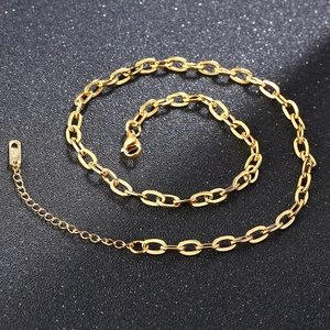 Close-up of gold stainless steel necklace lobster clasp and K18 hallmark detail