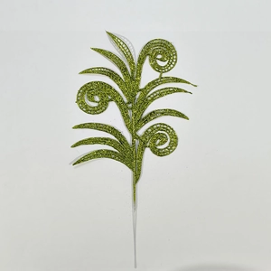 Macro detail of a green glitter artificial leaf branch for Christmas tree decoration