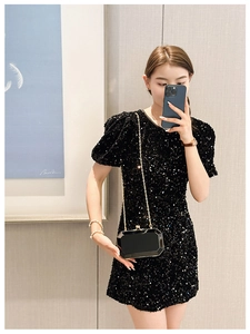 Chic black acrylic geometric evening clutch with gold chain shown as crossbody bag