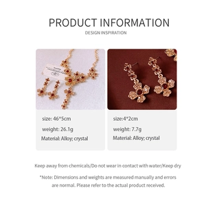 Detail view of red crystal water drop pendant necklace and earring set with dimensions