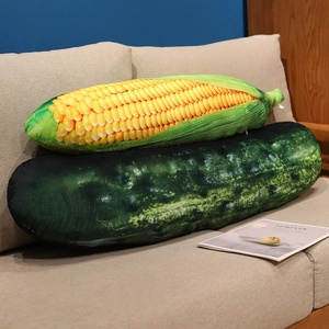 Realistic vegetable plush pillows featuring 3D printed corn and cucumber on a cozy sofa