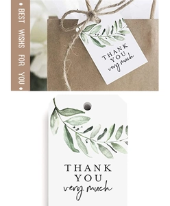 Detailed view of white Thank You gift tags with green leaf design and natural twine