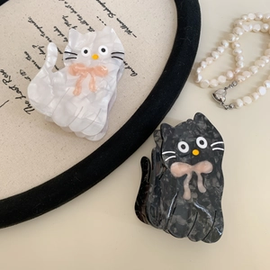 Cute acetate cat hair claw clips in marble white and grey with bow detail for women