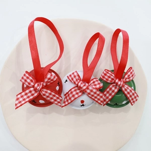 Set of 4cm metal Christmas bells with star cutouts and festive plaid ribbon bows