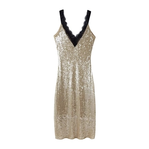 Elegant gold sequined dress with black lace straps and V-neckline in a flat lay view