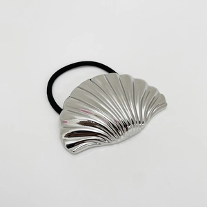 Macro shot of minimalist silver shell hair tie with black high-elasticity band