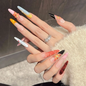 Stiletto press-on nails with 3D floral designs and water drop effects in vibrant colors