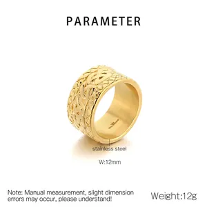 Macro detail of 12mm wide stainless steel ring with intricate woven texture and gold finish