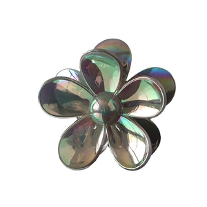 Iridescent flower hair claw clip with holographic finish and metallic petals for women