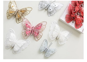 Detail of colorful sequined butterfly hair clips with glitter tulle and pearls