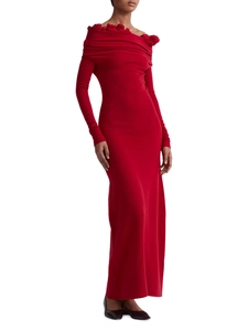 Detail of red off-shoulder knitted dress featuring 3D rose embellishments and texture